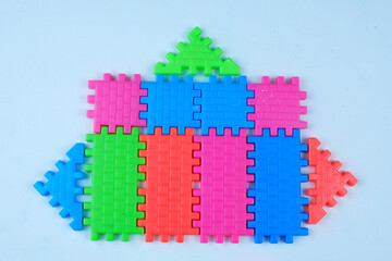 Colorful children's toy puzzle blocks. Disassembly of children's toys