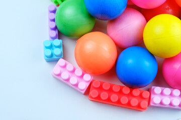 Colorful children's toy balls and puzzle blocks. Disassembly of children's toys