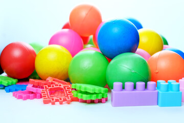 Colorful children's toy balls and puzzle blocks. Disassembly of children's toys