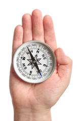 Hand holding traditional magnetic compass