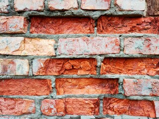 Obraz premium Old red brick wall close-up. Textured brick background.