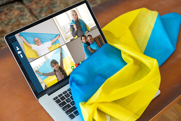 flag of ukraine, young woman teacher working with laptop sitting in classroom. Education, school...