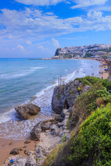 Bay of Peschici in Apulia, Italy: view of townscape and sandy beach. Peschici is famous town for...