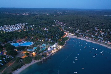 North Croatian sea shore with camp and hotel pools at night