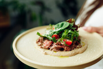 delicious appetizing food in a plate on the table in the river