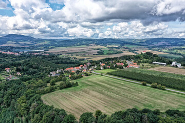 Czech village Ostre from the air with northern Bohemia