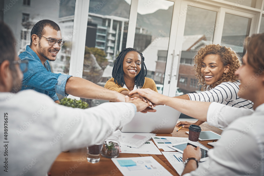 Poster This is what good teams are made of. Shot of a group of businesspeople joining their hands together in unity.