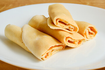 Crepes with marmalade on plate