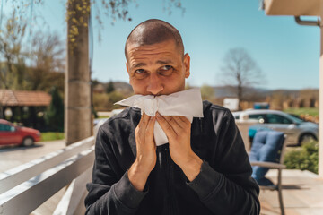 A man is wiping his mouth after a lunch
