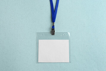 Blank badge on light table, top view. Mockup for design