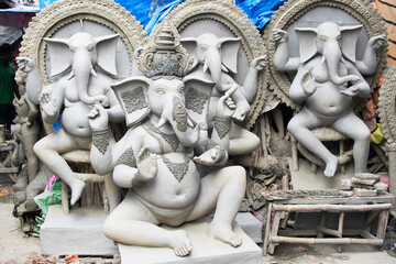 KOLKATA, WEST BENGAL, INDIA - 13 SEPTEMBER 2015: Clay idols of Lord Ganesha in series , at Kumartuli, as preparation for 