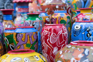 Fototapeta na wymiar Bright colorful terracotta pots, works of handicraft, on display during Handicraft Fair in Kolkata - the biggest handicrafts fair in Asia.