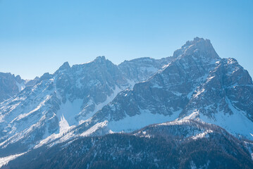 Fototapeta na wymiar Beautiful majestic kronplatz mountain range against clear blue sky in winter