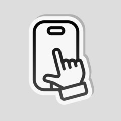 Mobile phone and hand, cellphone, simple icon. Linear sticker, white border and simple shadow on gray background