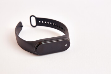 Multifunction fitness bracelet on a white background. Smart technology helps people.