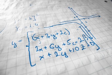 Mathematical formulas written in notebook closeup photo