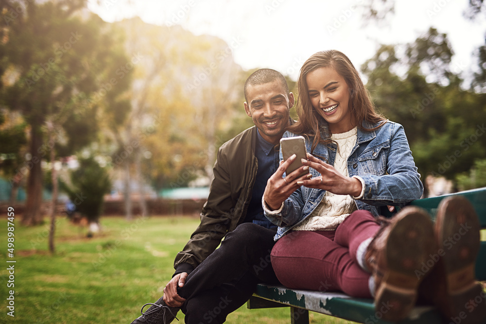 Aufkleber what do you think about this photo. shot of a cheerful young couple sitting down on a bench while us