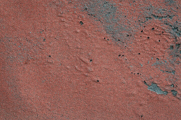grunge texture of building wall covered by aged and weathered roofing material