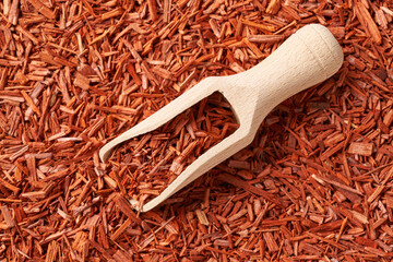 Red sandalwood chips on a scoop