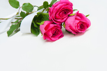 Abstract background with pink flowers roses on a white background