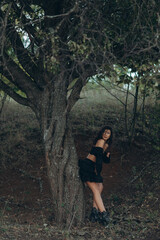 Close-up of beautiful young asian woman with stylish boho accessories on natural background