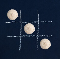 white coconut cookies on a blue background