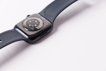 Concept of sports and healthy technologies. Modern design of high-tech smart watches. Smartwatch health sensors are highlighted on a white background. Inverted Black smartwatch with Insulated wrist