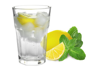 Glass with tasty lemonade, fresh ripe fruits and mint on white background