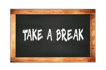 Fototapeta premium TAKE A BREAK text written on wooden frame school blackboard.
