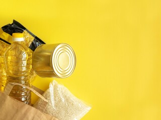 A paper bag with crisis food stocks for the period of the war. Buckwheat, canned food, pasta,...