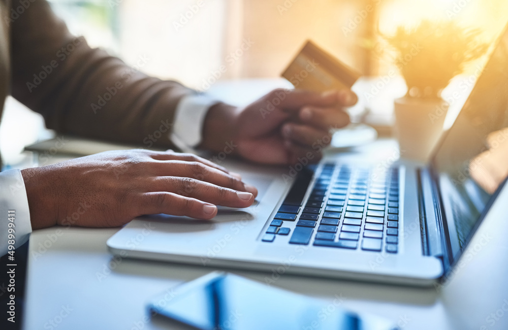 Canvas Prints Making all his business payments the convenient way. Closeup shot of an unidentifiable businessman making a payment online in an office.