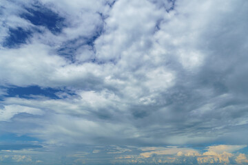 bright blue sky with clouds as abstract background