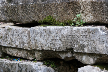 Ancient greek inscription on the basement of sarcophagus. Olympos, Turkey.