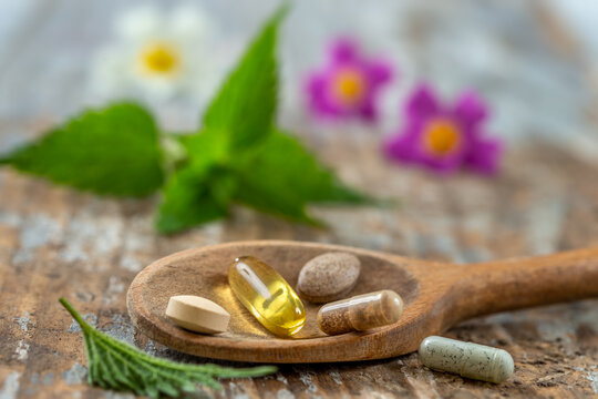 Wooden spoon of food suplements healthy medicine medication health.