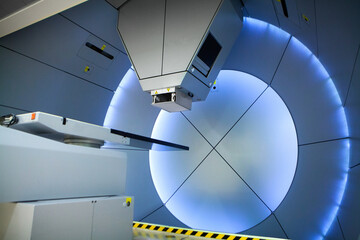Proton therapy irradiates cancer cells with a beam of protons inside. - obrazy, fototapety, plakaty