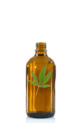 Cannabis leaf in a bottle - Conceptual image on white background.