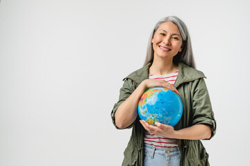 Geography and traveling concept. Smiling caucasian mature middle-aged woman holding hugging embracing planet Earth globe to protect save from contamination, war isolated in white background