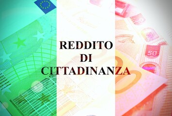 Italian flag and euro banknotes with the text "Reddito di cittadinanza" concept of monetary support from the italian government to unemployed people.