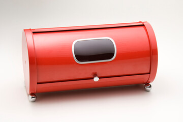 Red metal bread box closed, isolated