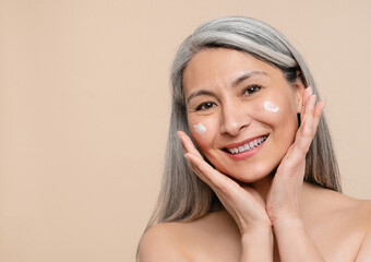 Anti-age anti-wrinkle effect of moisturizing creme cream. Caucasian mature middle-aged shirtless...