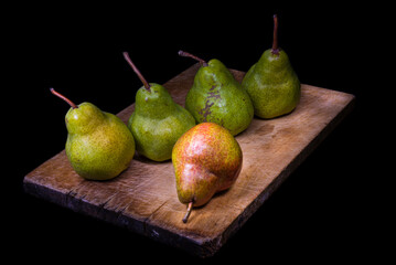 Fototapeta na wymiar Still life of pears on wooden cutting board