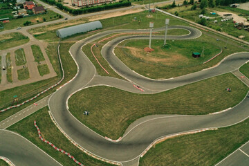 Aerial view of karting track. Go kart racing circuit. Contemporary curving race track for driving,...