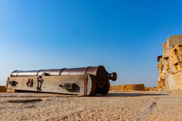 Jaisalmer, Rajasthan, India - October 13,2019 : Huge Cannon used in past for defence against attackers,on top of Jaisalmer Fort or Golden Fort, made of yellow sandstone, UNESCO world heritage site.