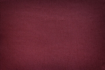 Texture of matte leather maroon color, vignette.