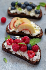 bruschetta with cottage cheese, blueberry, raspberry, mint leaves, nectarine