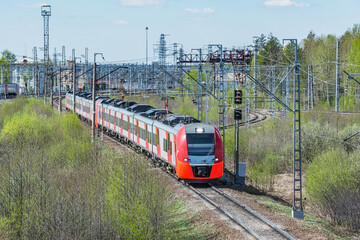 Naklejka premium Passenger train moves at summer morning.