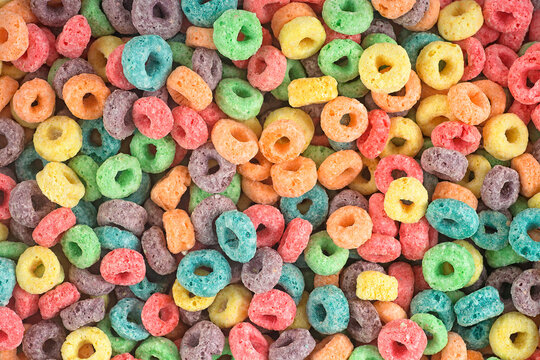 Delicious and nutritious fruit cereal loops as background. Healthy breakfast.