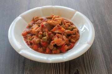 Meat , tomato peas dish , sautéed meat 