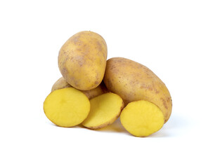 Several potato tubers and sliced potatoes on a white background.