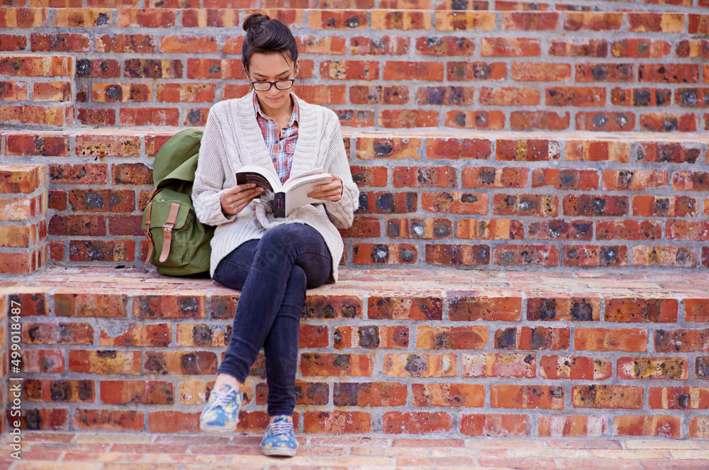 Poster The best way to predict your future is to create it. Cropped shot of a female university student on campus.